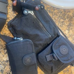 Fanny pack, black with matching wallet, in good used condition.